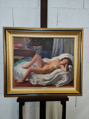 une peinture représentant une femme nue allongée sur un lit