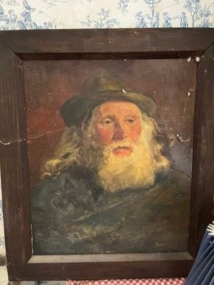 un tableau représentant un homme à la longue barbe et coiffé d'un chapeau