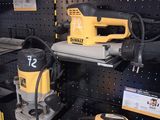yellow and black electric tools are on display in a store