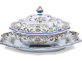 a white plate with a blue and orange design on it
