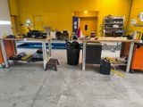 a room that has a lot of work equipment in it