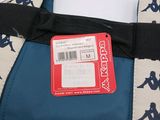 a blue and white bag with a black ribbon on it