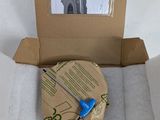 a cardboard box with a pair of scissors inside of it