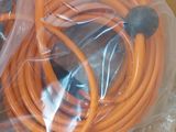 a box with a bunch of orange hoses inside of it