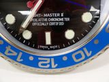 a close up of a blue and silver watch with a red second hand
