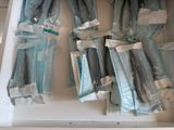 several pairs of blue jeans are in a white box