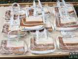 many bags of food wrapped in plastic on a table