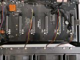 a close up of a computer board with wires attached to it