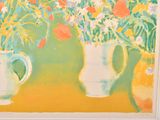 three vases with flowers in them sitting on a table