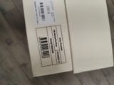 a box with a barcode on it sitting on a wooden floor