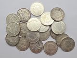 a lot of coins that are on the table