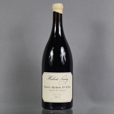 a bottle of wine sitting on top of a glass table
