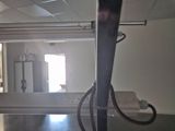a view of a bathroom with a sink and a mirror