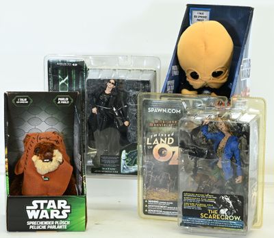 several star wars action figures are displayed on a white surface