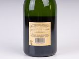 a bottle of wine that is sitting on a table
