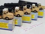 four toy army trucks with guns on top of them