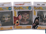 two boxes of pop disney vinyl figures are shown in a row