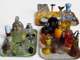 two trays that have different types of perfumes on them