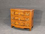 a wooden chest of drawers with drawers and drawers on each side