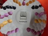 a paper plate with a design on it on a table