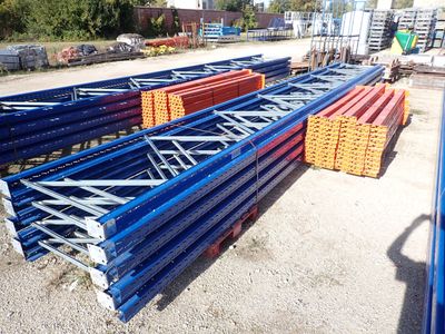 a close up of a pile of metal beams in a parking lot