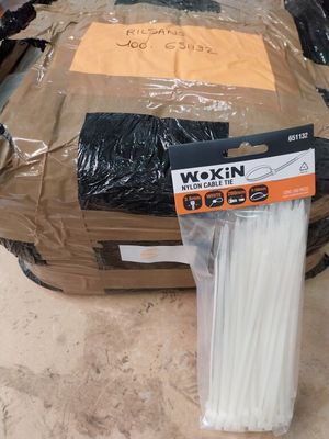 a box with a bunch of white sticks in it
