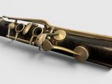 close up of a clarinet on a white background