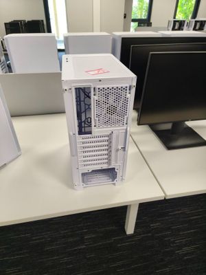 a desktop computer sitting on a desk in front of a computer monitor