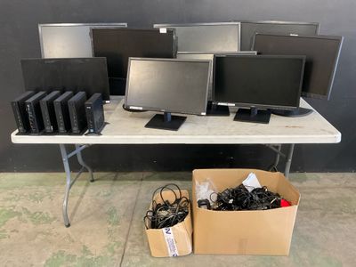 a lot of computers that are on a table