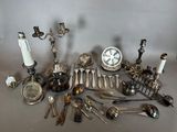 many different types of silverware on the table