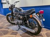 a motorcycle that is parked on the floor in the room