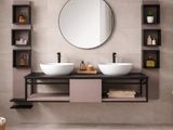 a bathroom with two sinks and a mirror on the wall