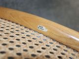a close up of a wooden handle on a chair