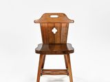 an image of a wooden chair with a cross on the back