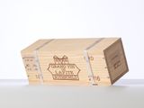a wooden box with a label on it sitting on a table