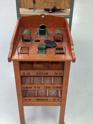 a small wooden table with a clock on top of it
