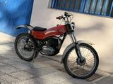 a red motorcycle parked on the side of the street