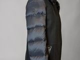 the back of a black jacket with a fur collar on a mannequin mannequin mannequin mannequin mannequin mannequin manne