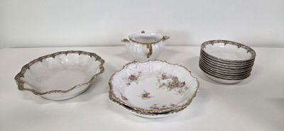 a white table topped with dishes and cups and saucers