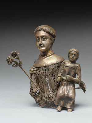 une image représentant une statue en bronze d'une femme tenant un enfant dans ses bras