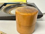 a wooden box sitting on a table next to a pair of scissors