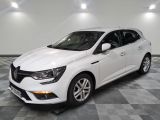 a white car parked in a room with a checkered floor