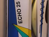 two surfboards in a box on a shelf