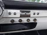 a close up of a car dashboard with a clock on it