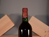 a bottle of wine that is sitting on a table