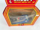 a box with a toy car inside of it on a white surface