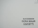 a sign that says succession dora maar on the wall
