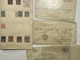 several old envelopes are sitting on top of each other on a table