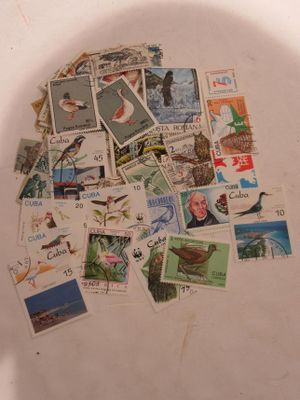 a white toilet with a lot of stamps on it