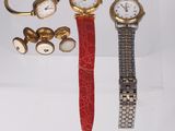 several watches and bracelets are displayed on a clear display case
